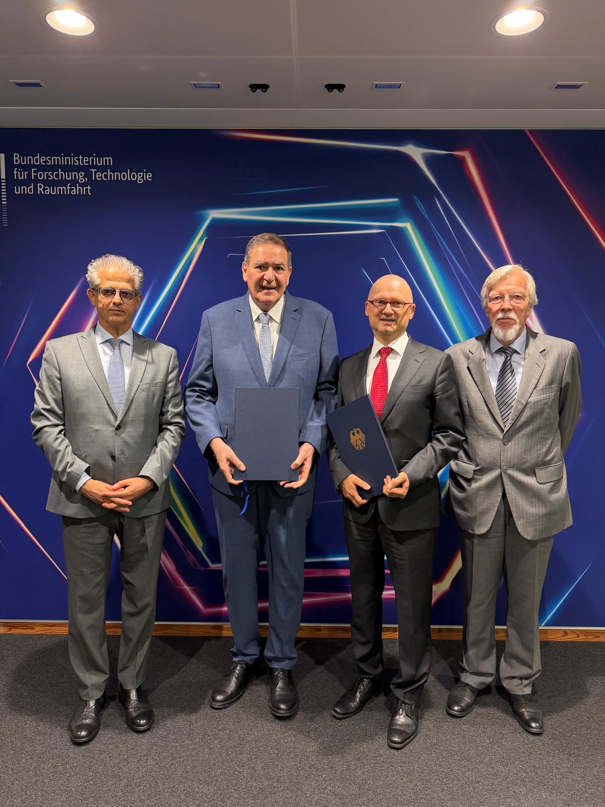 © BMFTR 2026: From left to right: H.E. Fayiz Khouri, Ambassador of the Hashemite Kingdom of Jordan to Germany; Dr. Khaled Toukan, Director of SESAME; Dr. Marcus Pleyer, State Secretary at the Federal Ministry of Research, Technology and Space (BMFTR); and Prof. Rolf-Dieter Heuer, President of the SESAME Council.